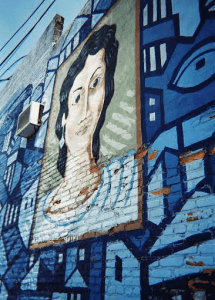 Mural by Minas in Baltimores Greektown neighborhood of Leini Leftafkis from the novel, Orlo & Leini